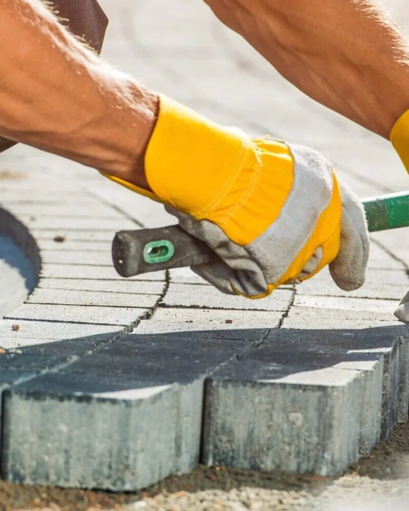 Garden Brick Pathway Paving by Professional Paver Worker.
